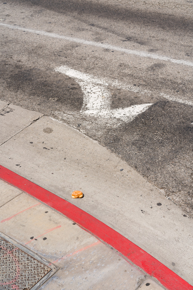 A discarded donut on the road