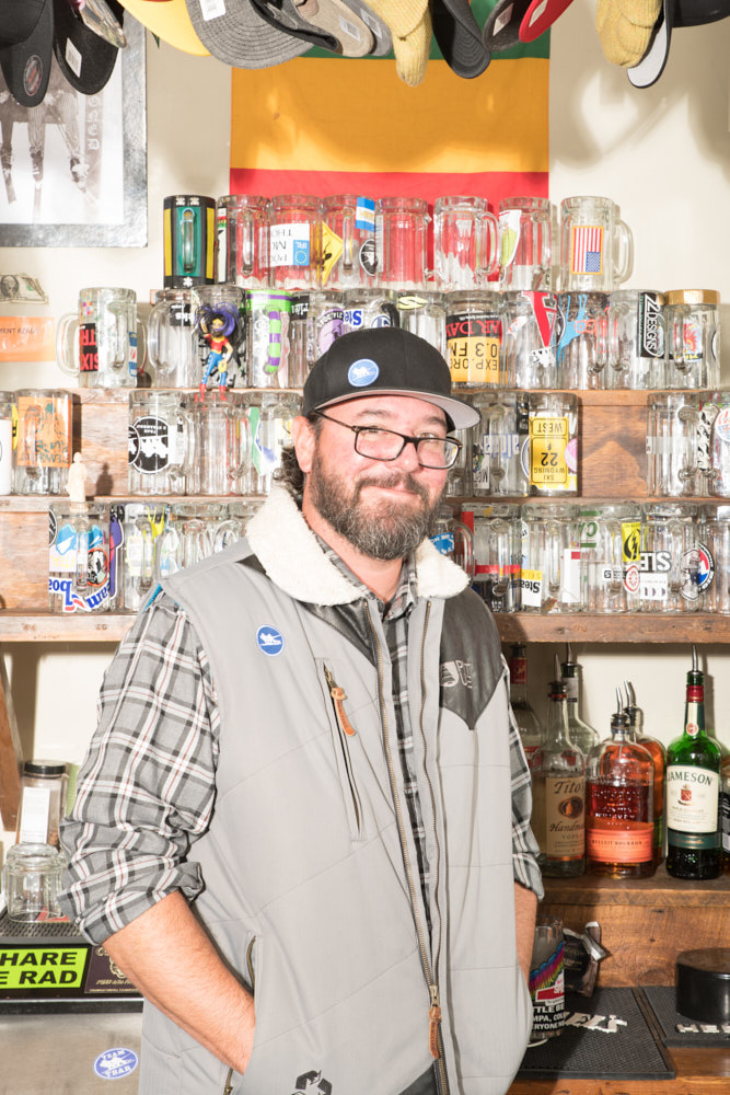 A bartender behind the bar