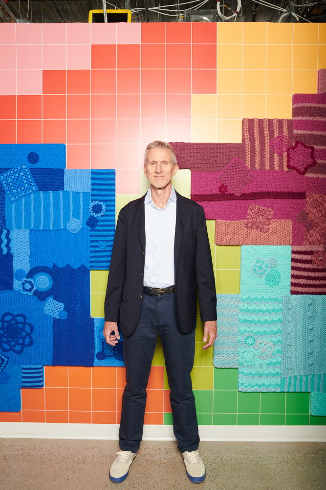 A portrait of Steve Rendle in front of a Smartwool display