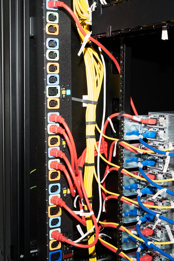 Power and fiber optic cables inside a server cluster