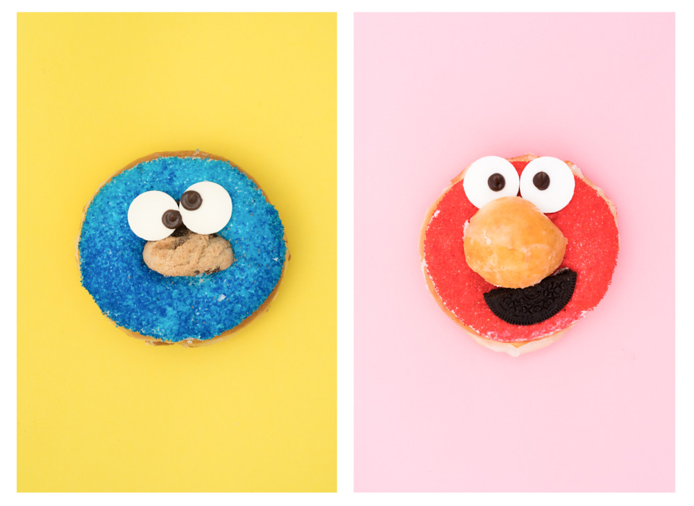 Two donuts decorated as Cookie Monster and Elmo
