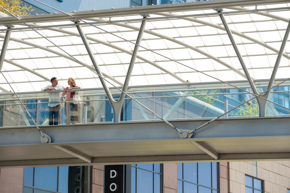 A couple on a bridge walkway