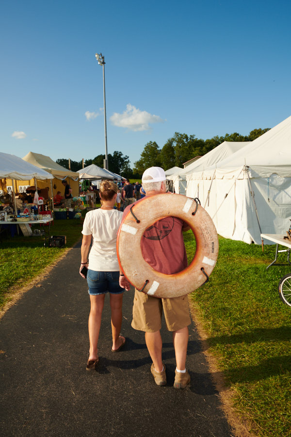 A couple carrying a buoy