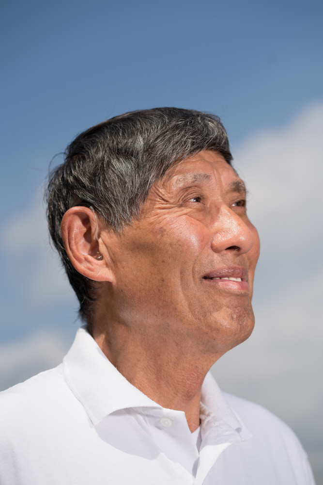 A headshot portrait of Jim Nakano