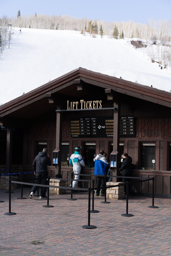 Skiers buying lift tickets in Vail Village