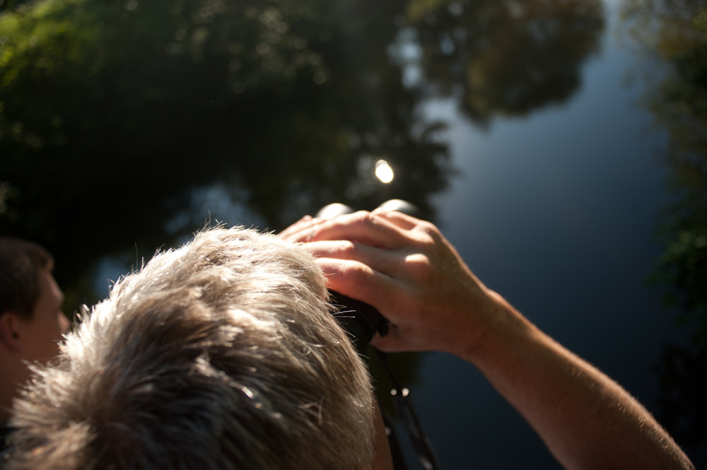 A man and his son using binoculars