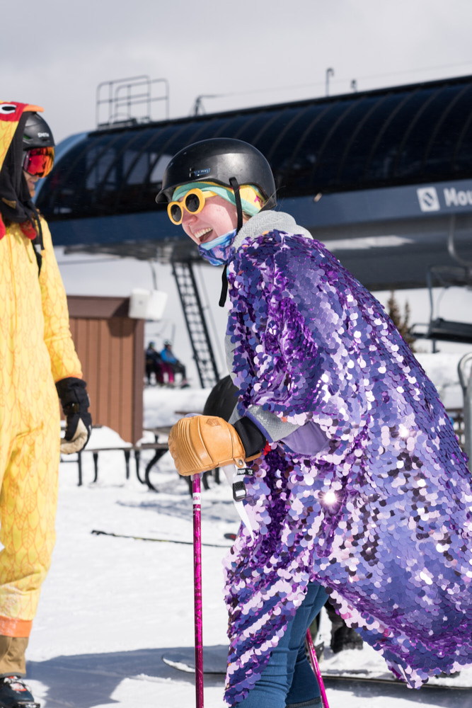 Two skiers wearing costumes