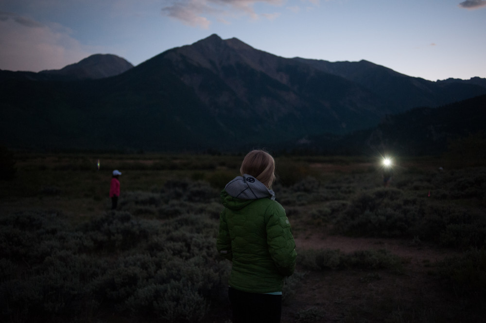 Runners in the mountains at dusk