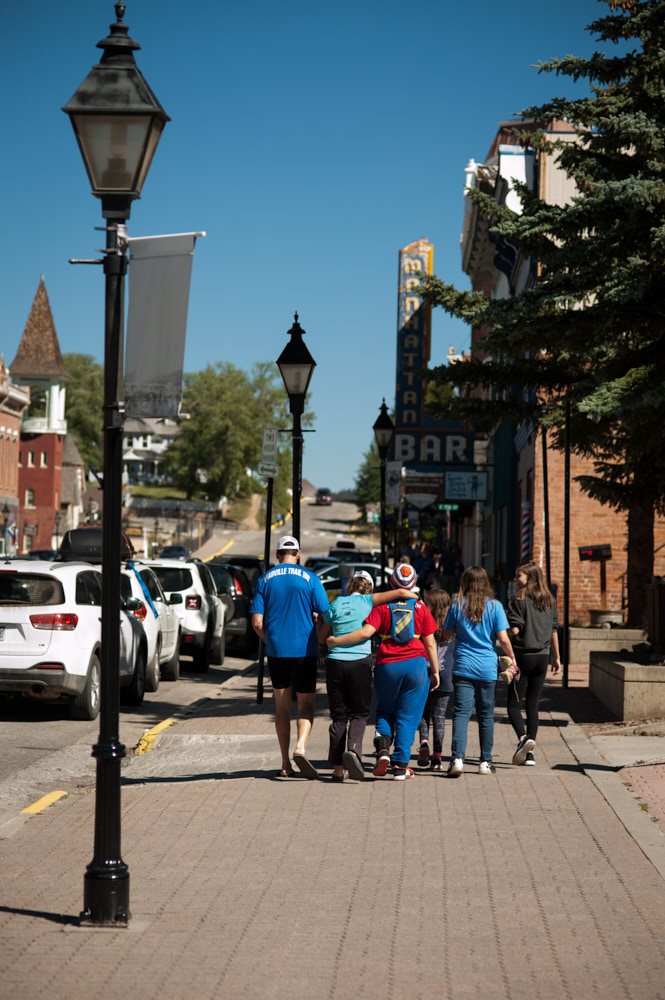 A runner being carried away after finishing the Leadville 100 race