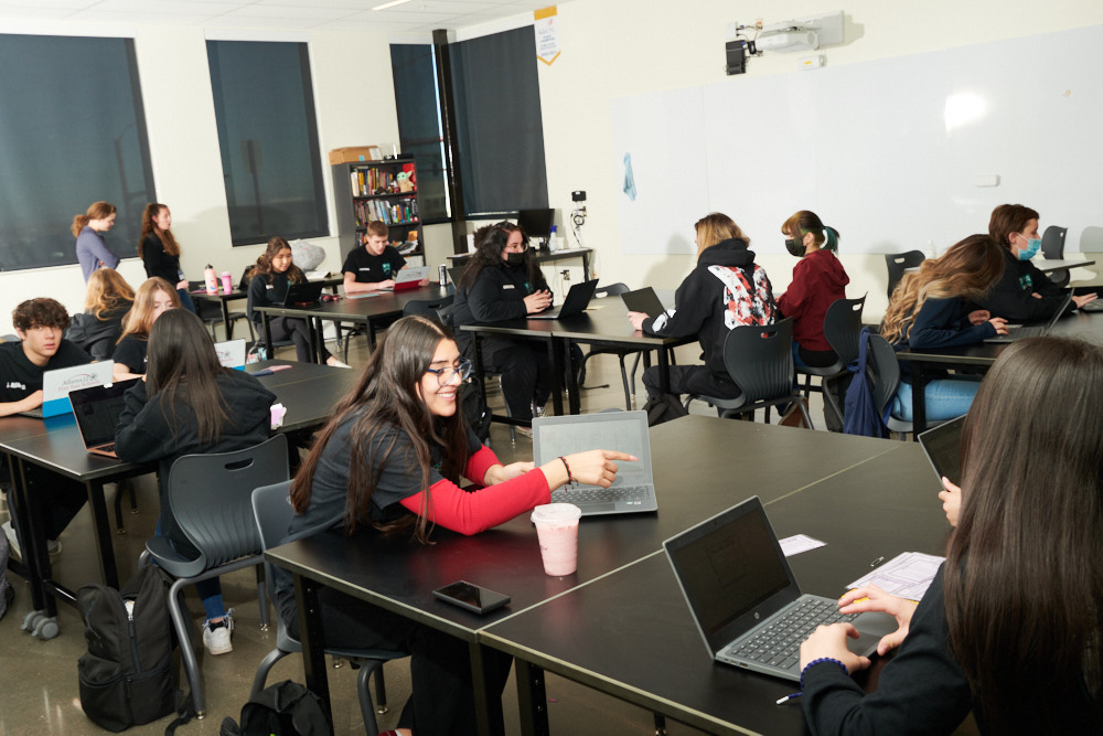 Students using laptops in a classroom