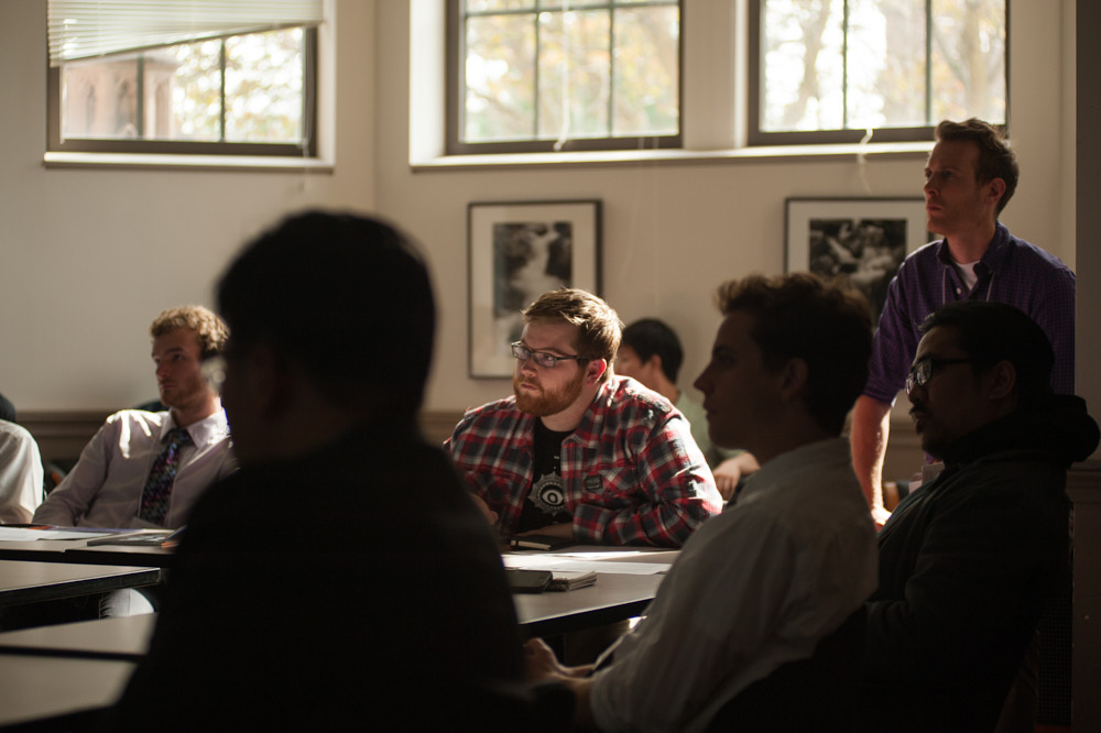 Students sitting and listening to a lecture in a classroom