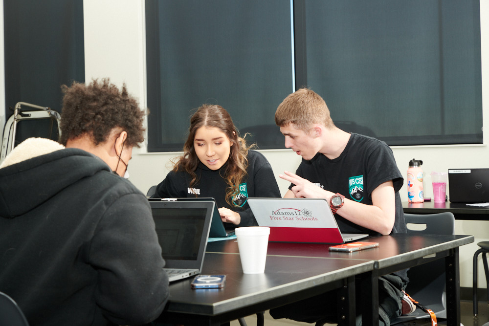 Students talking in a classroom