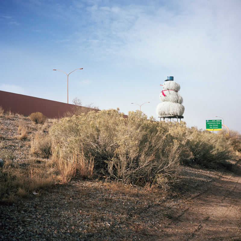 A tumbleweed snowman next to the highway
