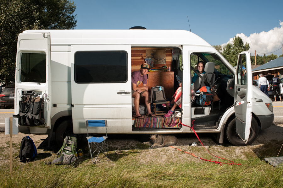 A support van with people sitting inside