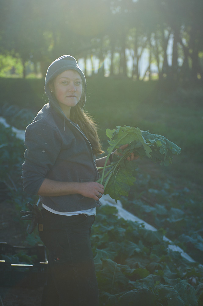 A portrait of a young farmer as the sun rises