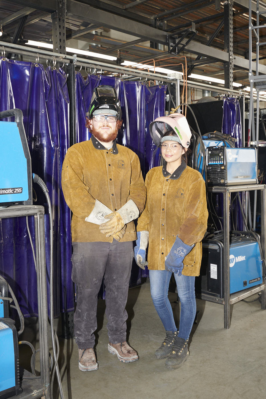 023-two-welders-in-front-of-curtain-portrait