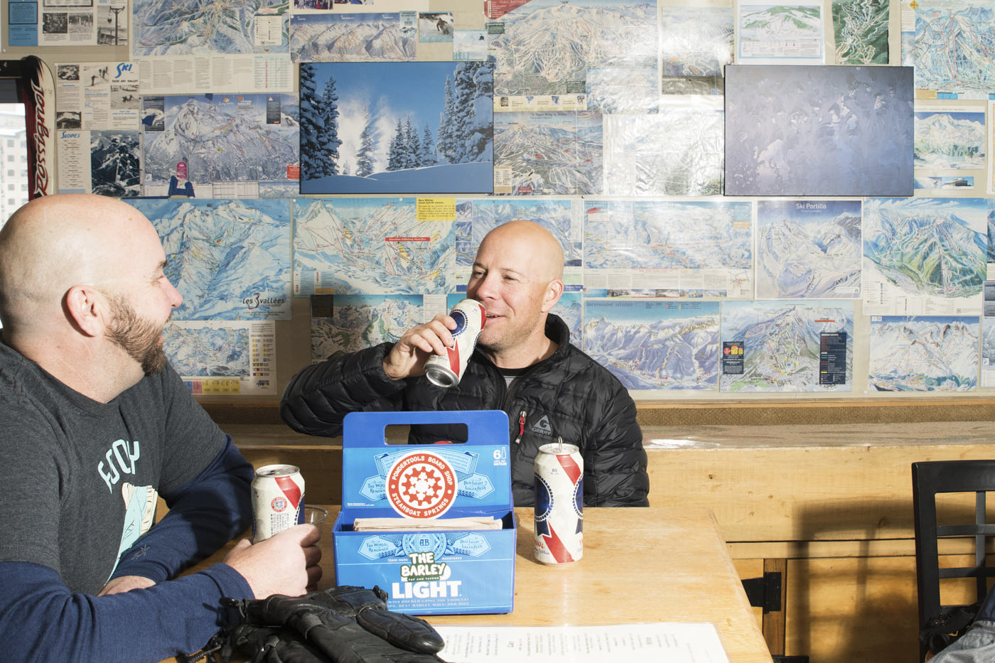 024-two-men-drinking-beers-in-ski-hut