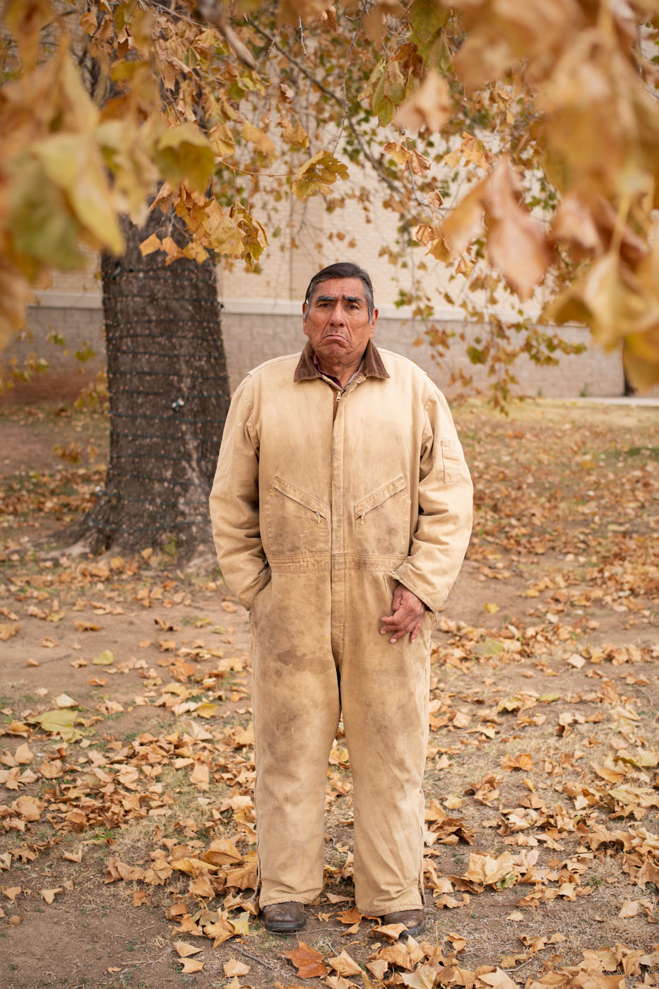 024-worker-brown-suit-portrait